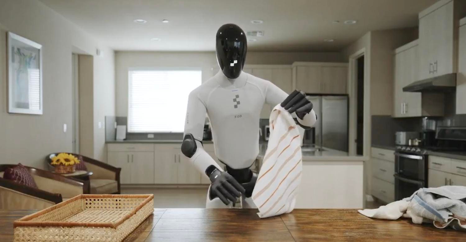 Snimak ekrana s Figureovog prenosa uživo: humanoid Figure 03 obavlja kućne poslove